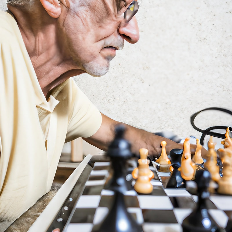 Picture of a senior citizen playing chess